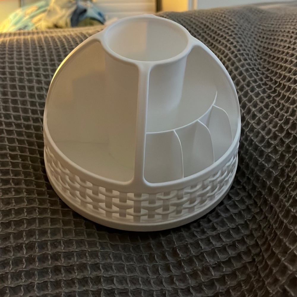 White rotating makeup organizer